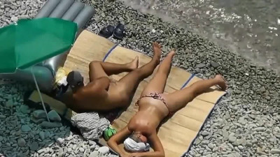 Nude handjob at the beach